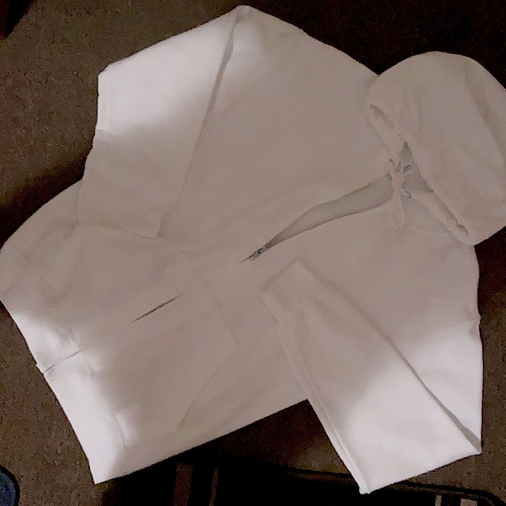 A white zip up sweatshirt brand new